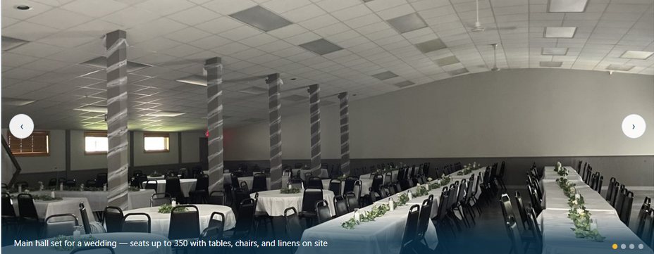 The main hall set for a wedding reception with round and banquet tables, seating for 350